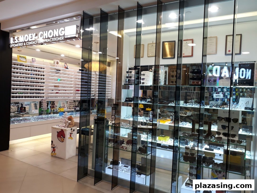 The shopfront of B.S Moey-Chong Optometrist, displaying a wide range of eyeglasses and sunglasses.