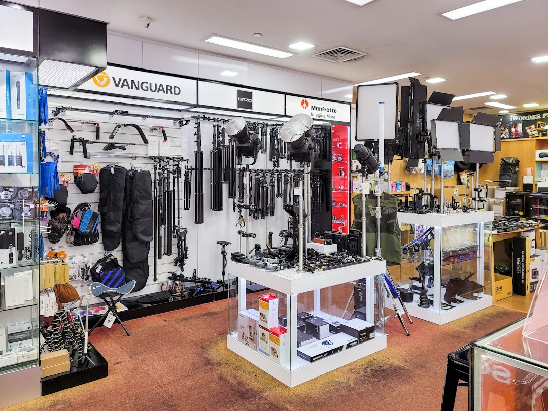 Interior view of Bally Photo Electronics, showcasing professional camera equipment, lighting, and accessories.
