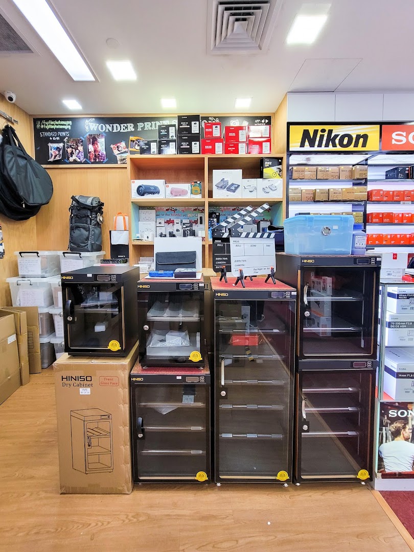 Interior view of Bally Photo Electronics, showcasing camera equipment, electronics, and dry cabinets.