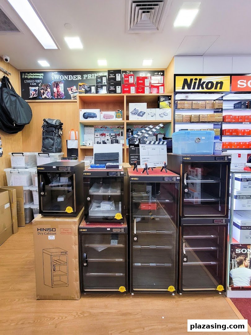 Interior view of Bally Photo Electronics, showcasing camera equipment, electronics, and dry cabinets.
