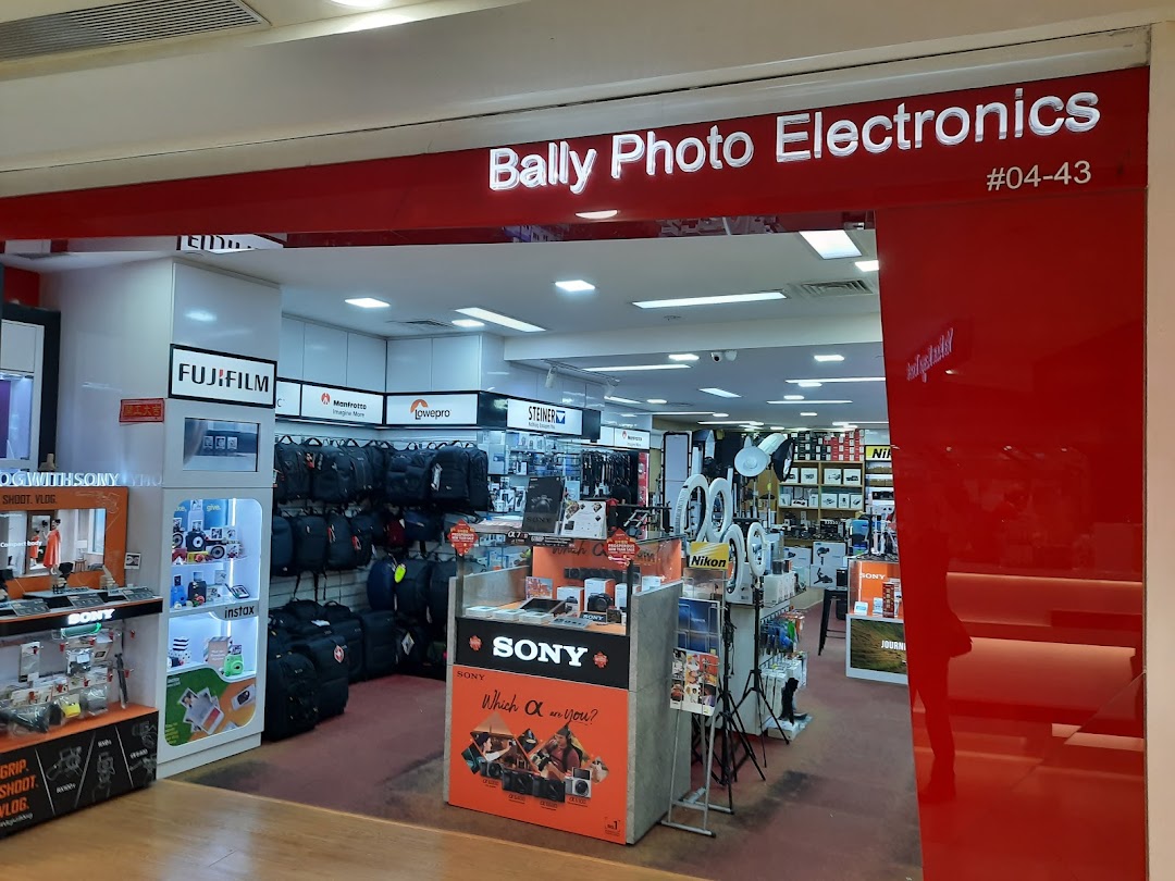 The entrance of Bally Photo Electronics, showcasing cameras, accessories, and various electronics.