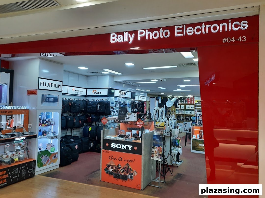The entrance of Bally Photo Electronics, showcasing cameras, accessories, and various electronics.