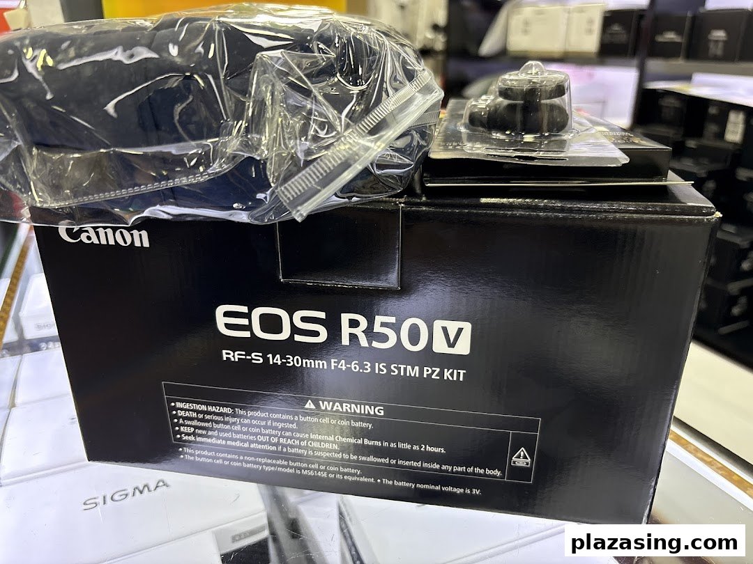 Close-up of a Canon EOS R50V camera kit box in a retail store.