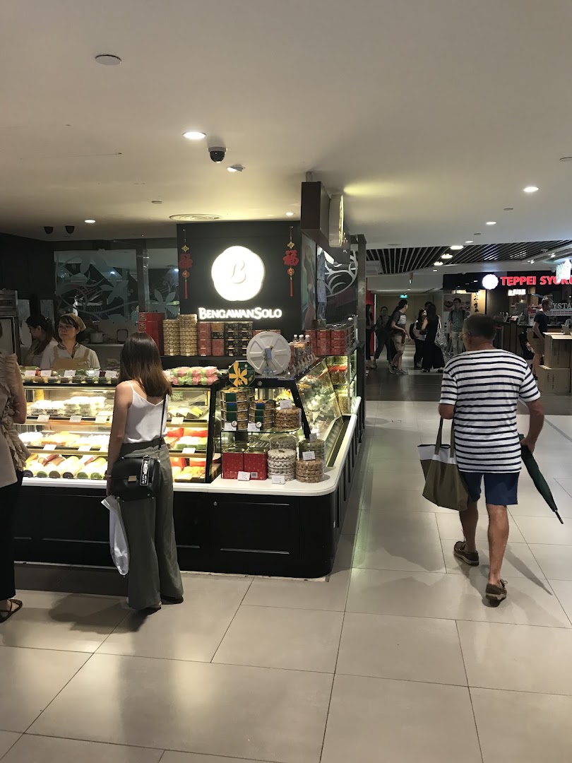 Interior view of Bengawan Solo showcasing display cases filled with traditional Indonesian cakes and snacks.