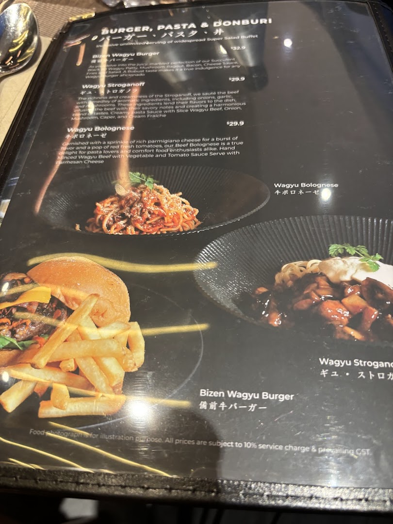 A close-up view of a menu featuring Wagyu burgers, pasta, and donburi dishes with descriptions and prices.
