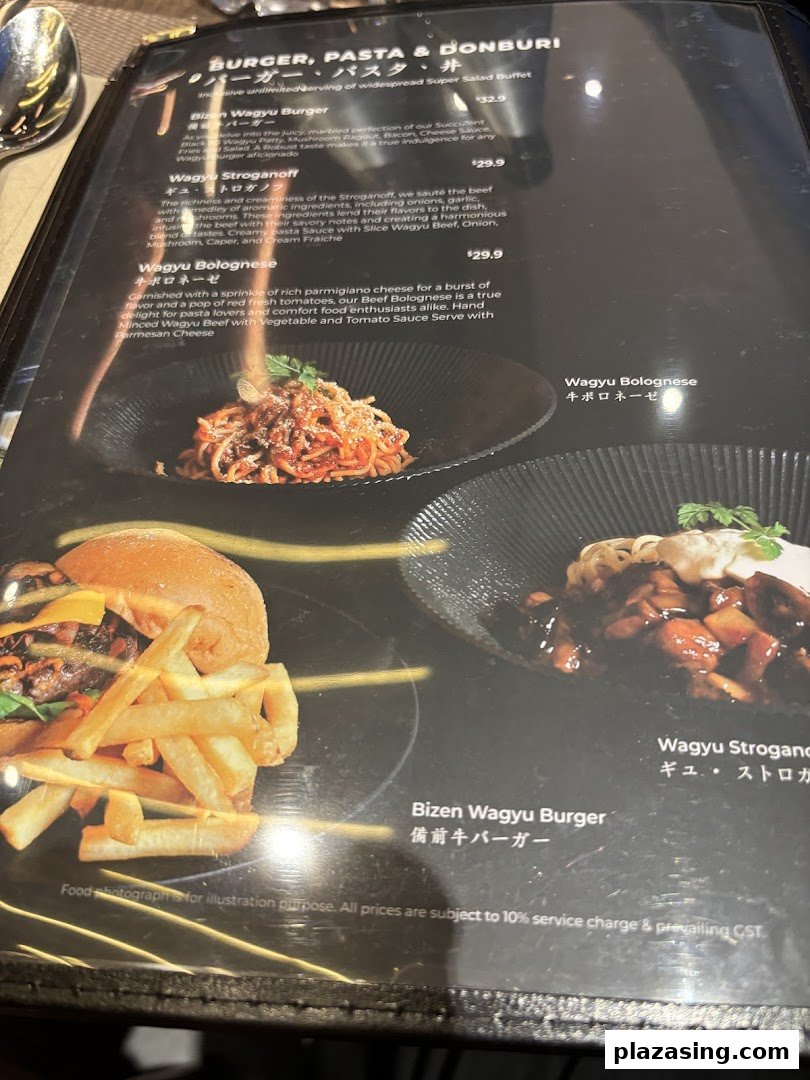 A close-up view of a menu featuring Wagyu burgers, pasta, and donburi dishes with descriptions and prices.
