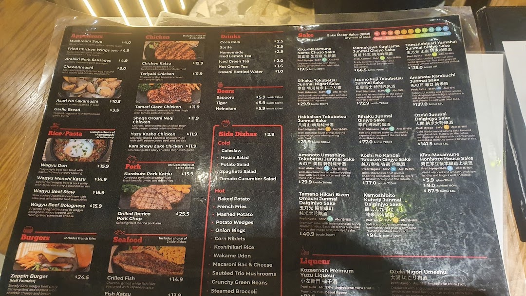A comprehensive menu displaying a wide array of Japanese dishes, including Wagyu, chicken, pork, seafood, and an extensive sake list.