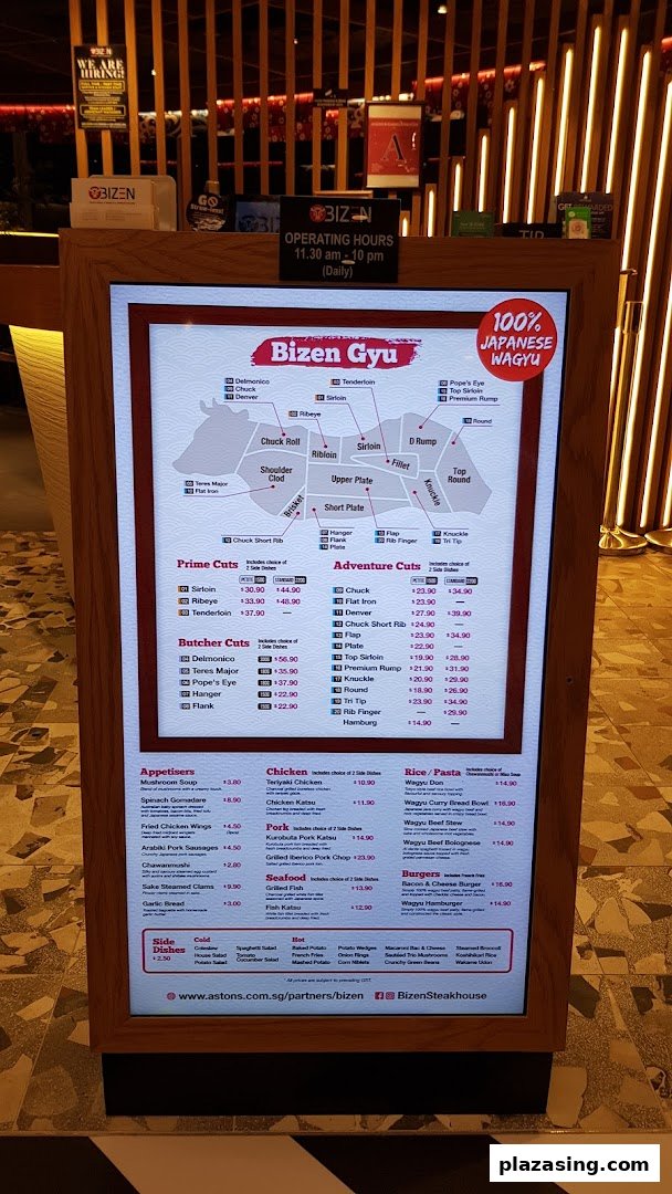 A digital menu board displaying various wagyu beef cuts, appetizers, and other dishes from Bizen Wagyu.
