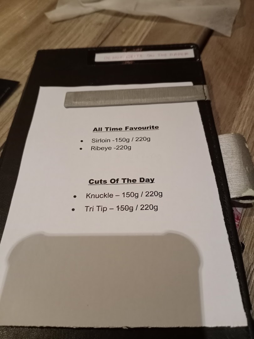 A menu displaying popular steak cuts and daily specials with their respective weights.