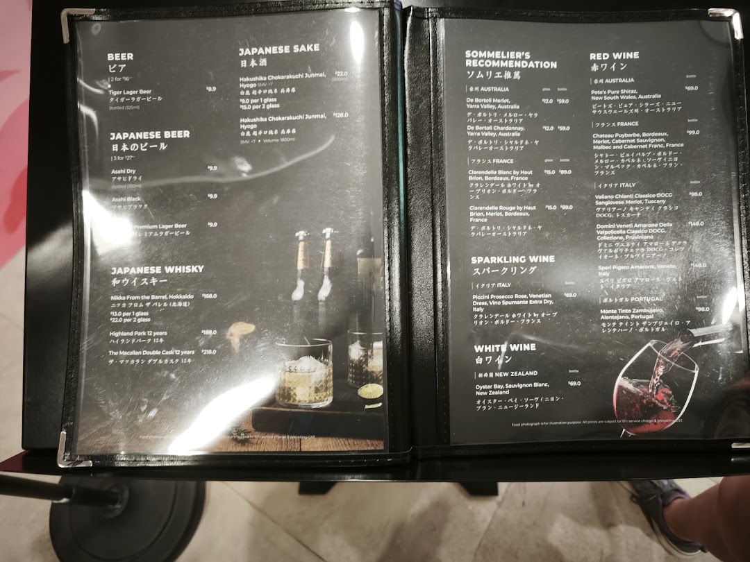 A detailed menu displaying a selection of beers, Japanese sake, whiskies, and various wines.