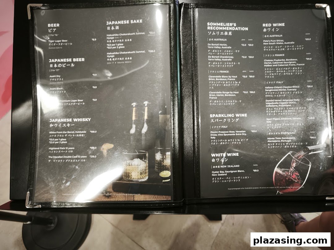 A detailed menu displaying a selection of beers, Japanese sake, whiskies, and various wines.