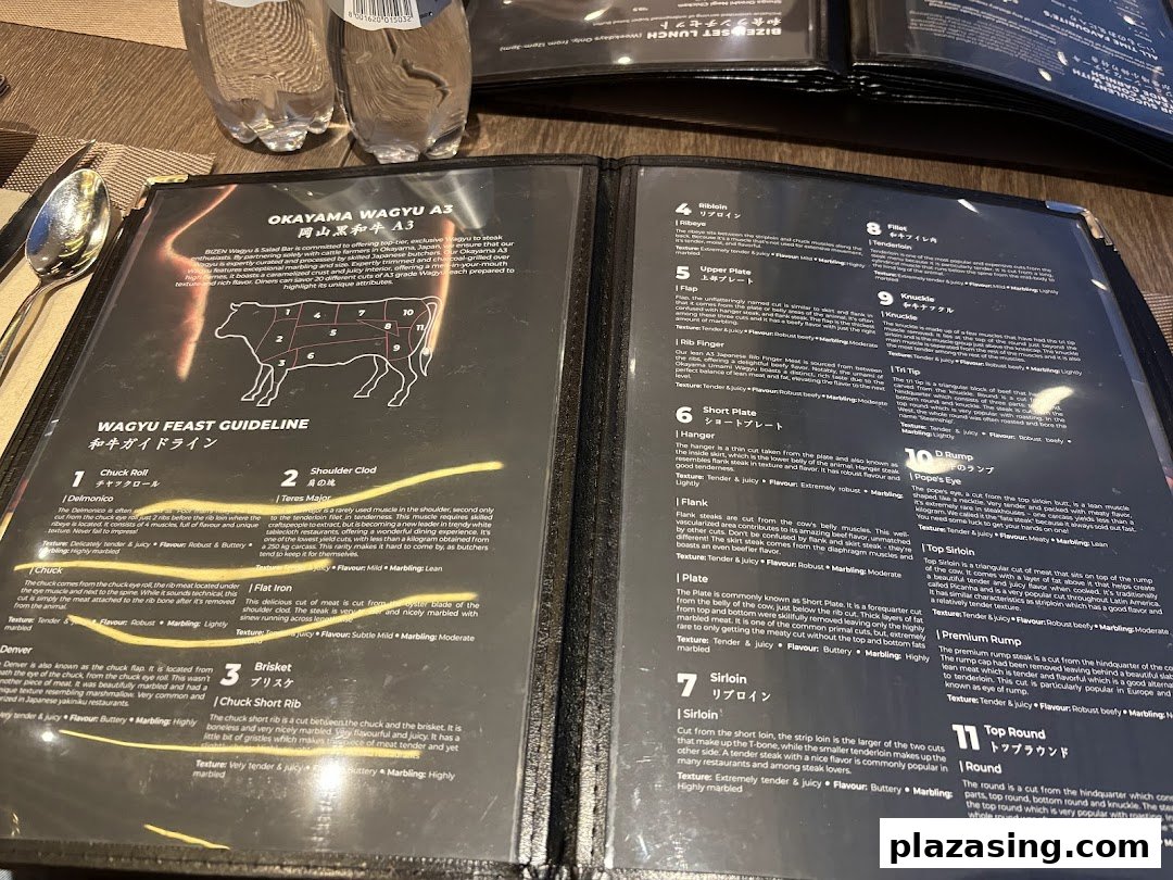 An open menu displaying detailed descriptions of various Okayama Wagyu A3 beef cuts.