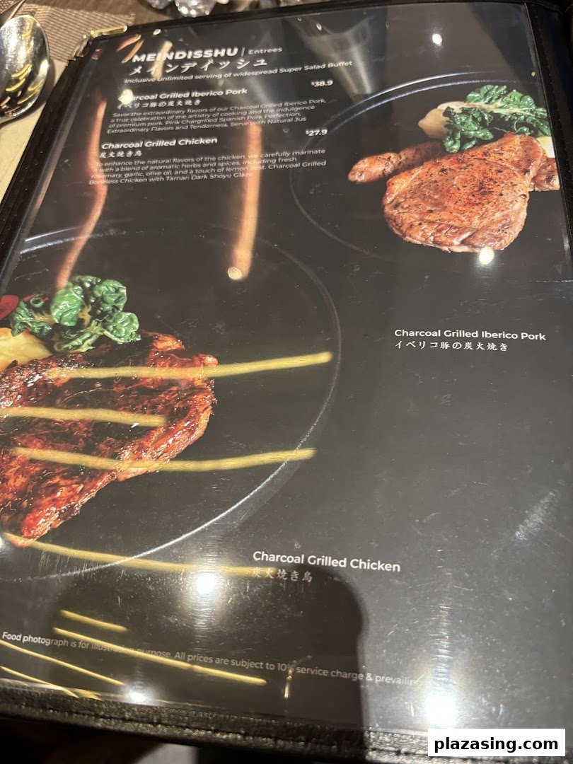 A close-up of a restaurant menu displaying charcoal-grilled pork and chicken entrees with descriptions and prices.