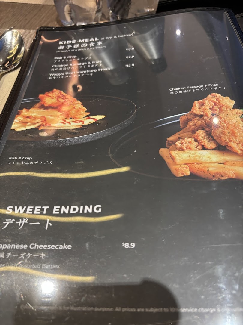 A close-up view of a menu page featuring kids' meals and a dessert option.