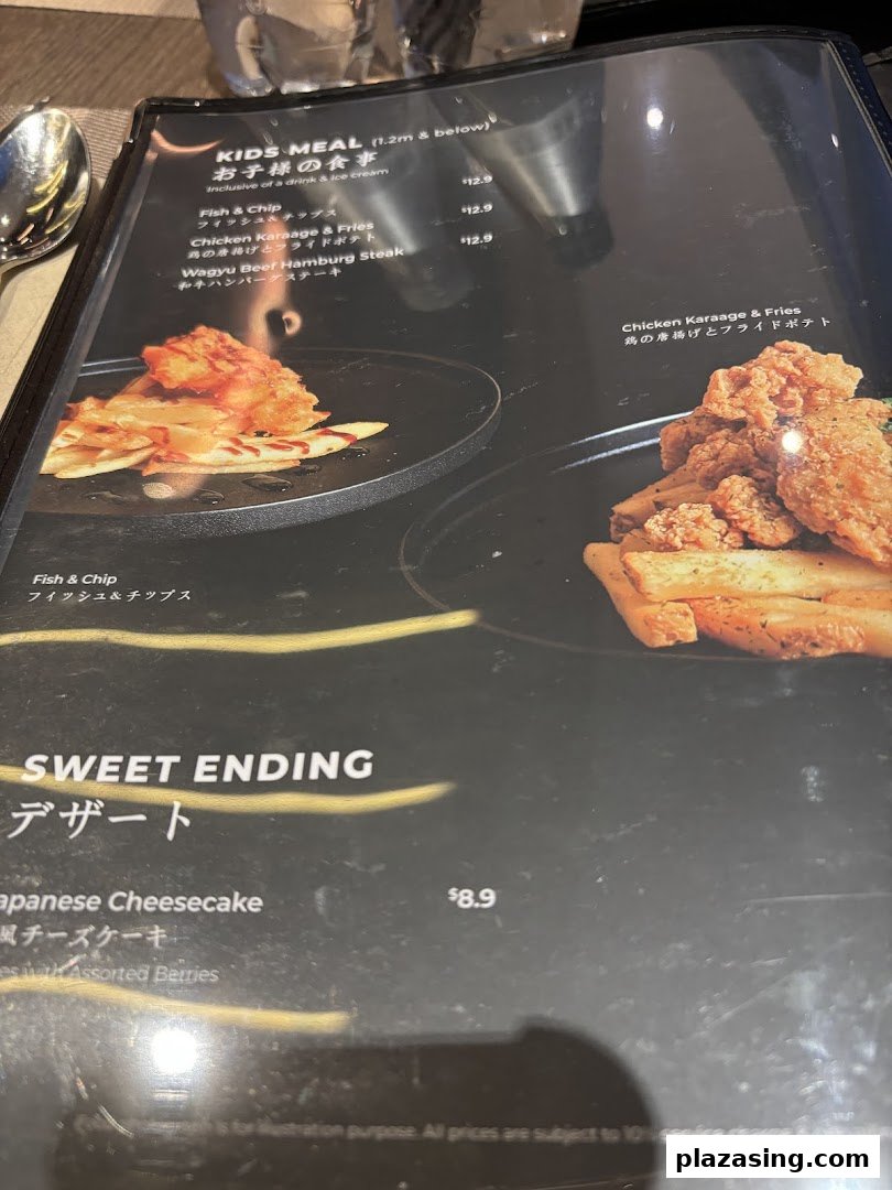 A close-up view of a menu page featuring kids' meals and a dessert option.