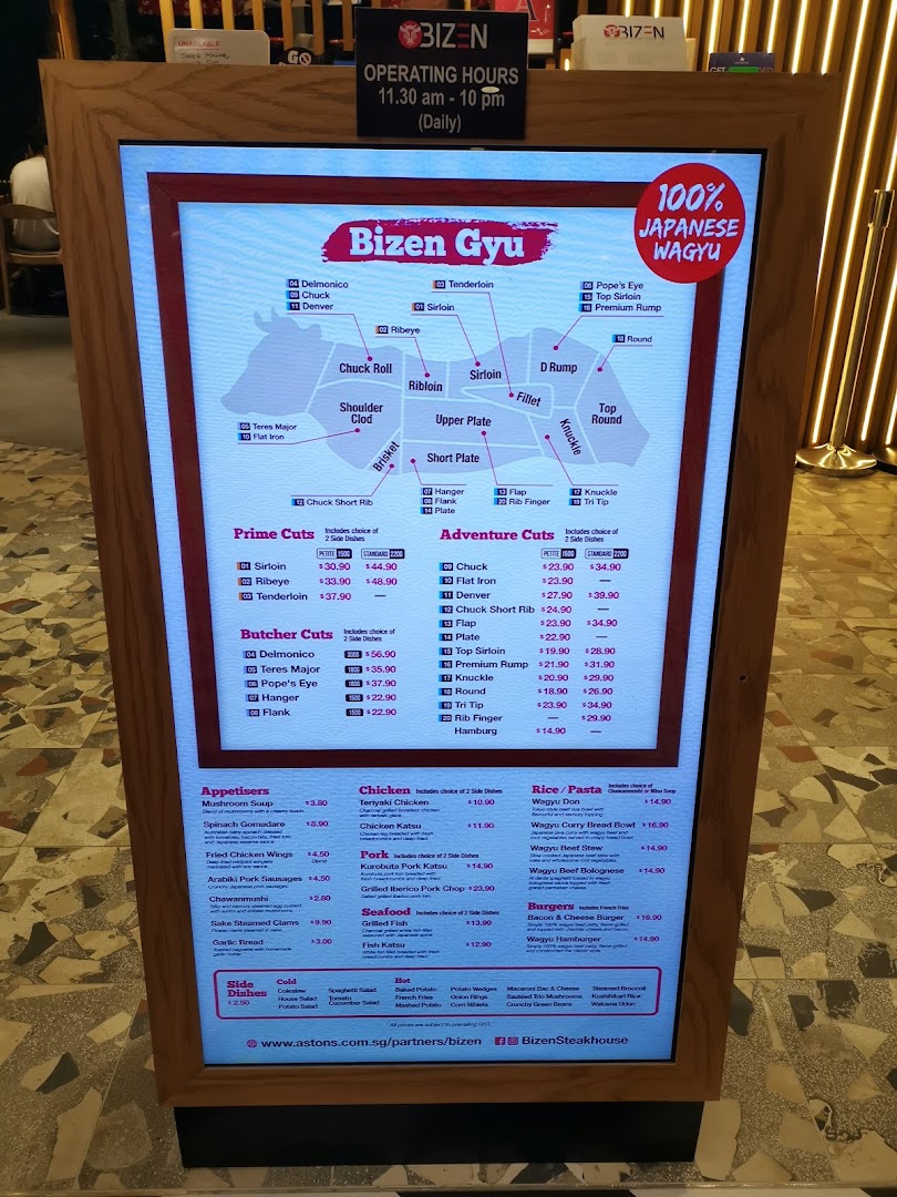 A digital menu display showcasing various cuts of 100% Japanese Wagyu beef and other dishes.