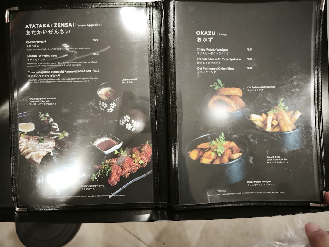A detailed view of a menu displaying warm appetizers and side dishes with prices and descriptions.