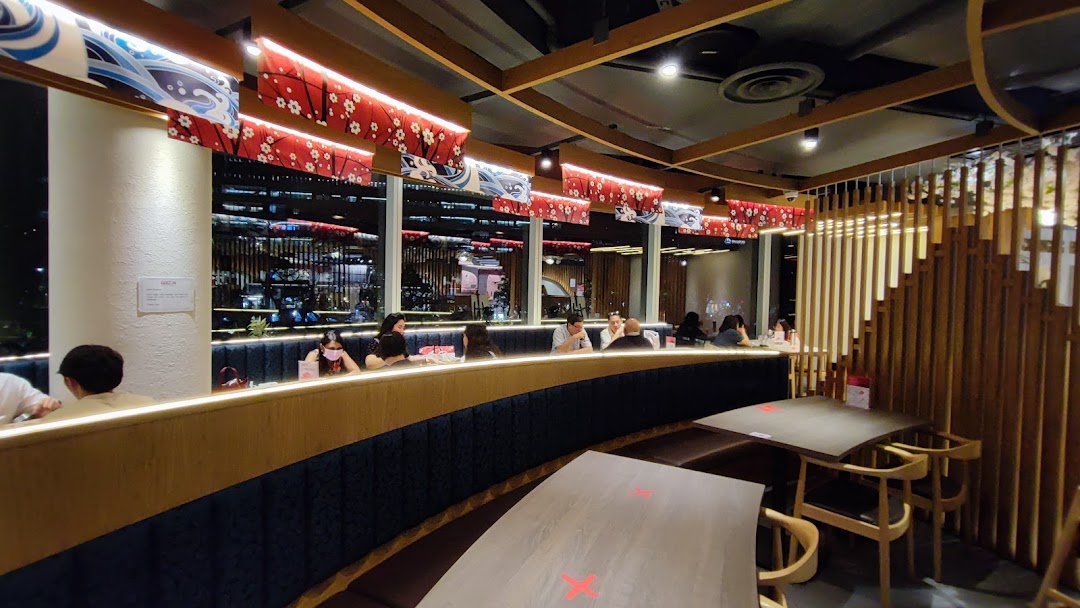 A warm, inviting interior of Bizen Wagyu Salad Bar with customers dining and Japanese-inspired decor.