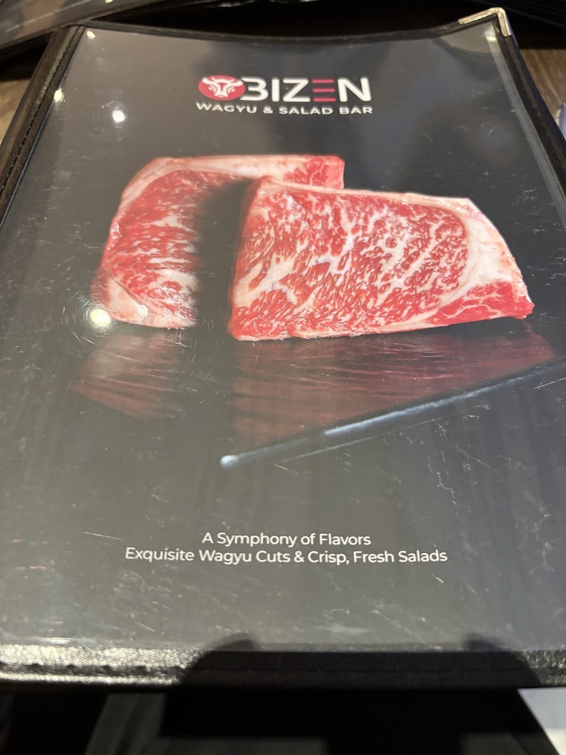 Close-up of Bizen Wagyu & Salad Bar's menu cover, featuring premium Wagyu beef and promotional text.