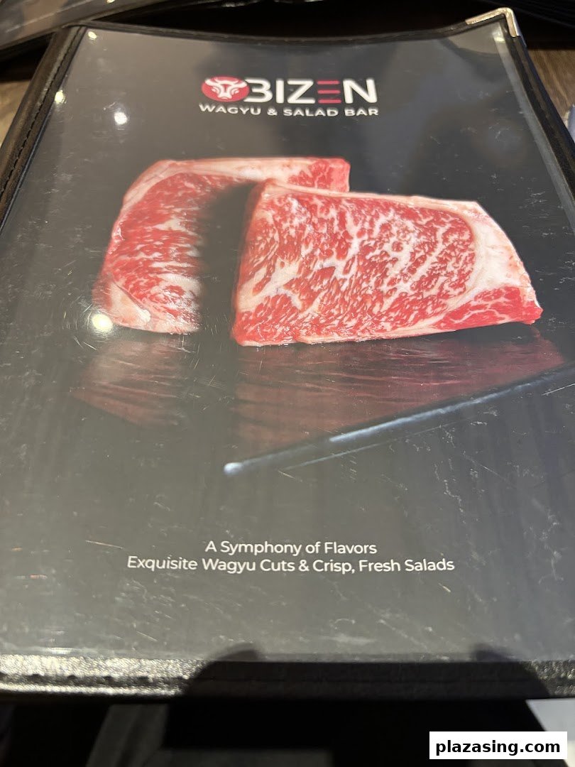 Close-up of Bizen Wagyu & Salad Bar's menu cover, featuring premium Wagyu beef and promotional text.