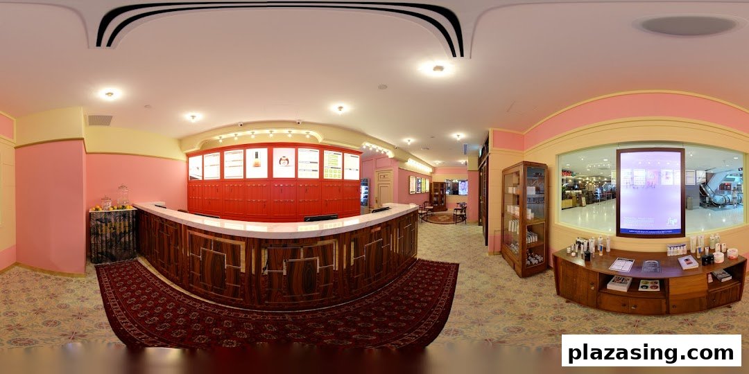 Interior view of Browhaus reception area featuring a curved counter, product displays, and a waiting lounge.