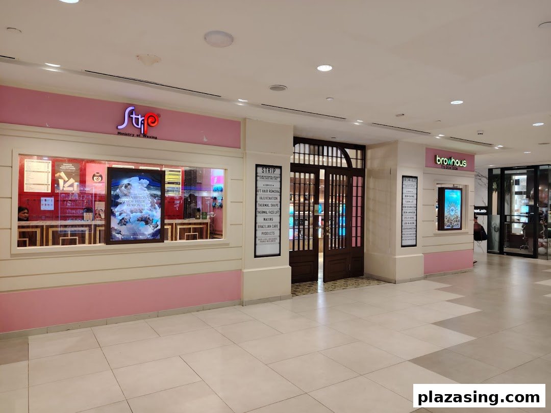 The inviting storefronts of Browhaus and Strip Ministry of Waxing in a modern shopping mall.