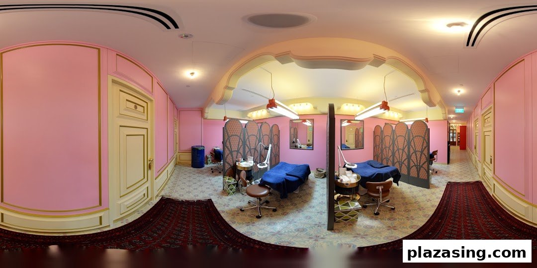 A vibrant pink and gold interior of Browhaus, featuring multiple treatment stations with privacy screens and elegant decor.