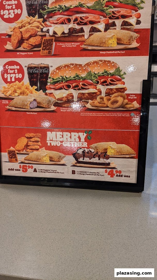 A vibrant Burger King menu board showcasing various combo meals and add-ons.