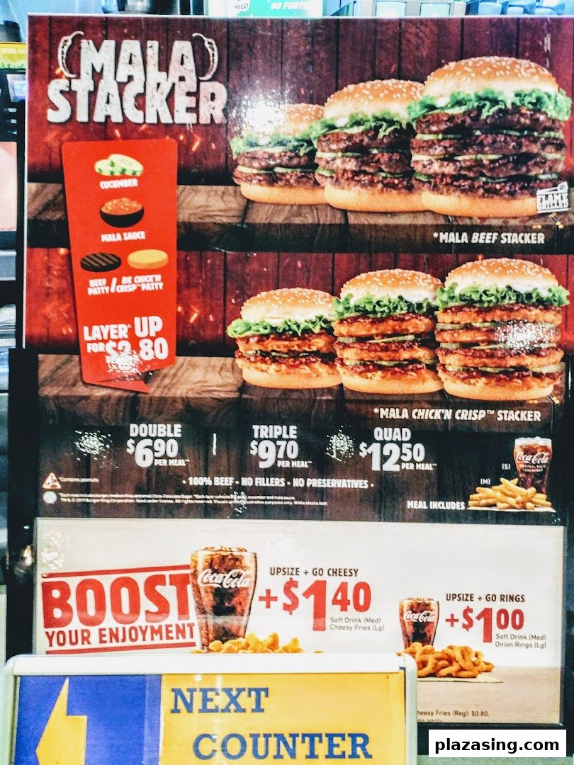 A Burger King menu board featuring Mala Stacker burgers and upsize options.