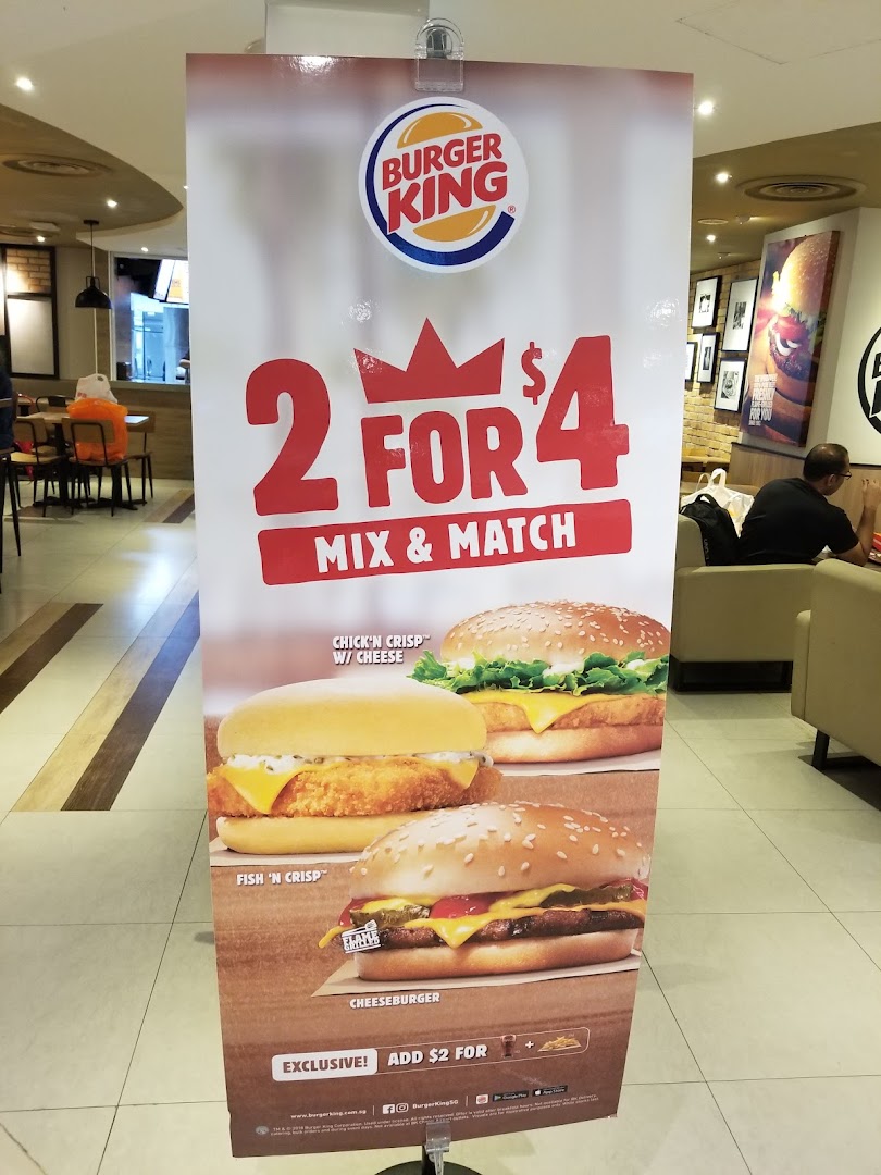 A Burger King promotional stand showcasing a '2 for $4 Mix & Match' deal with burgers and a side upgrade.