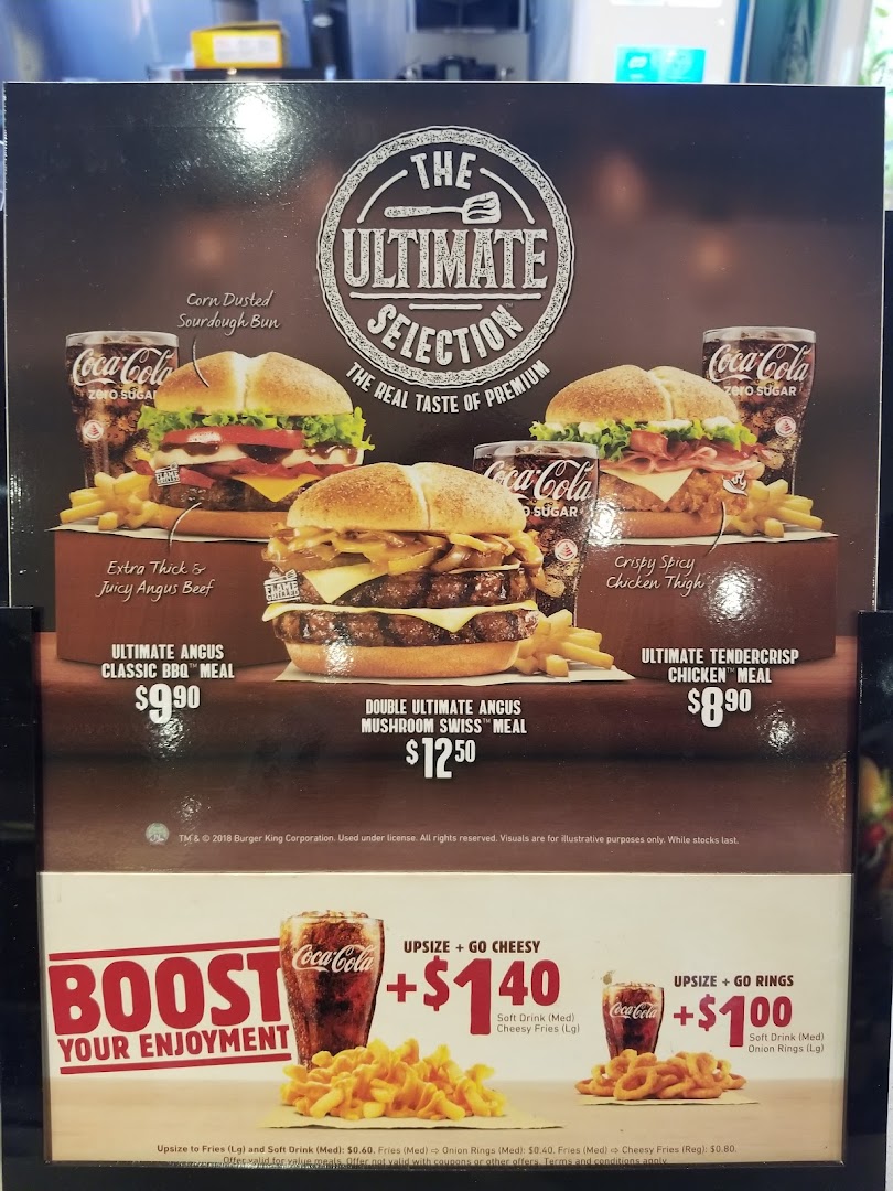 A Burger King menu board showcasing 'The Ultimate Selection' burgers and upsize options.