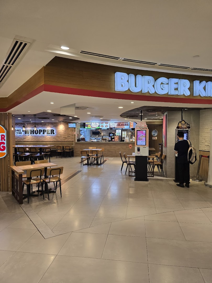 View of Burger King's spacious entrance, counter, and dining area within Plaza Singapura.