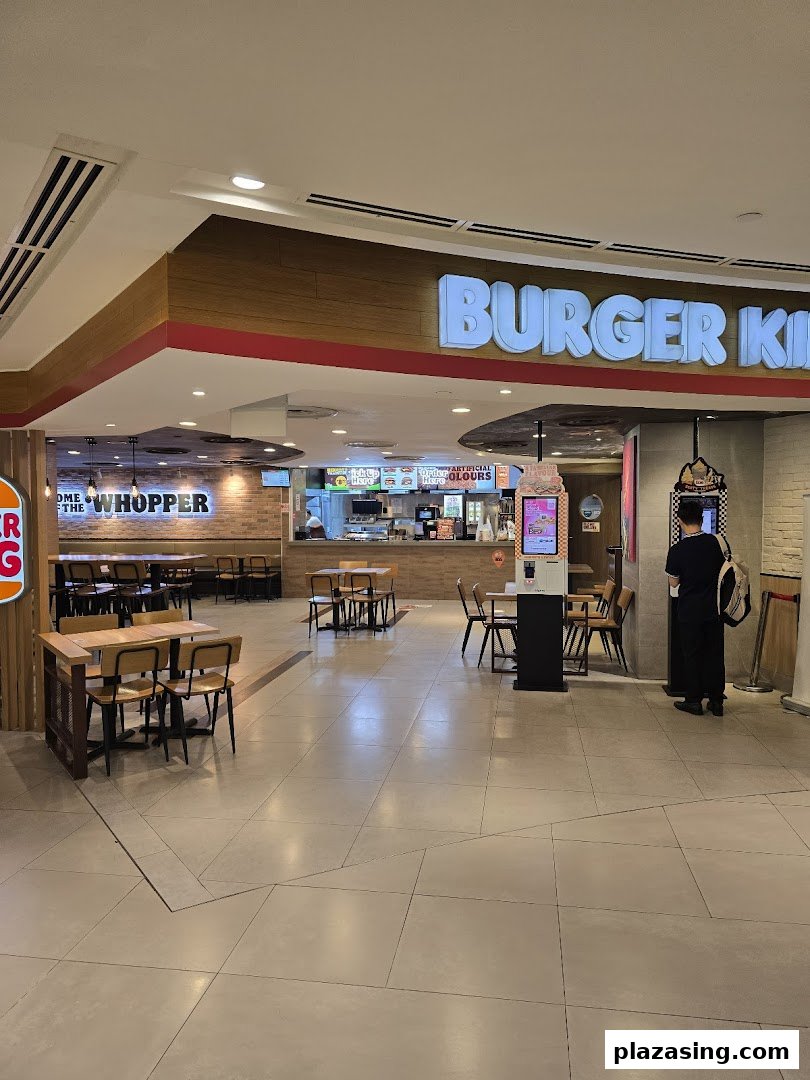 View of Burger King's spacious entrance, counter, and dining area within Plaza Singapura.