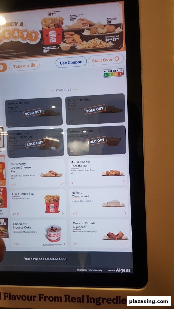 A self-service kiosk displaying Burger King's menu items, including sold-out options.