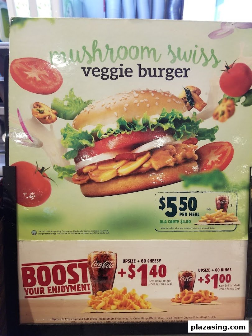 A Burger King menu board showcasing a Mushroom Swiss Veggie Burger and upsizing options.