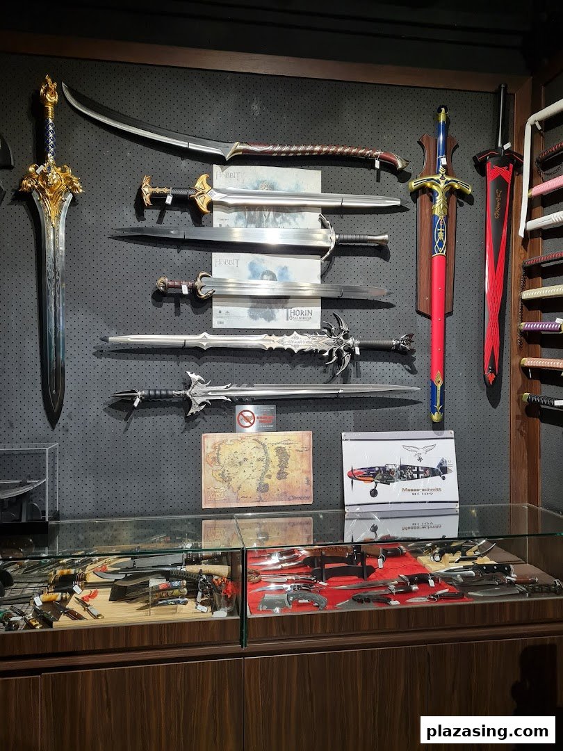 An interior shot of CAESARS Swords.Guns.Armour, showcasing a display of fantasy swords, knives, and collectibles.
