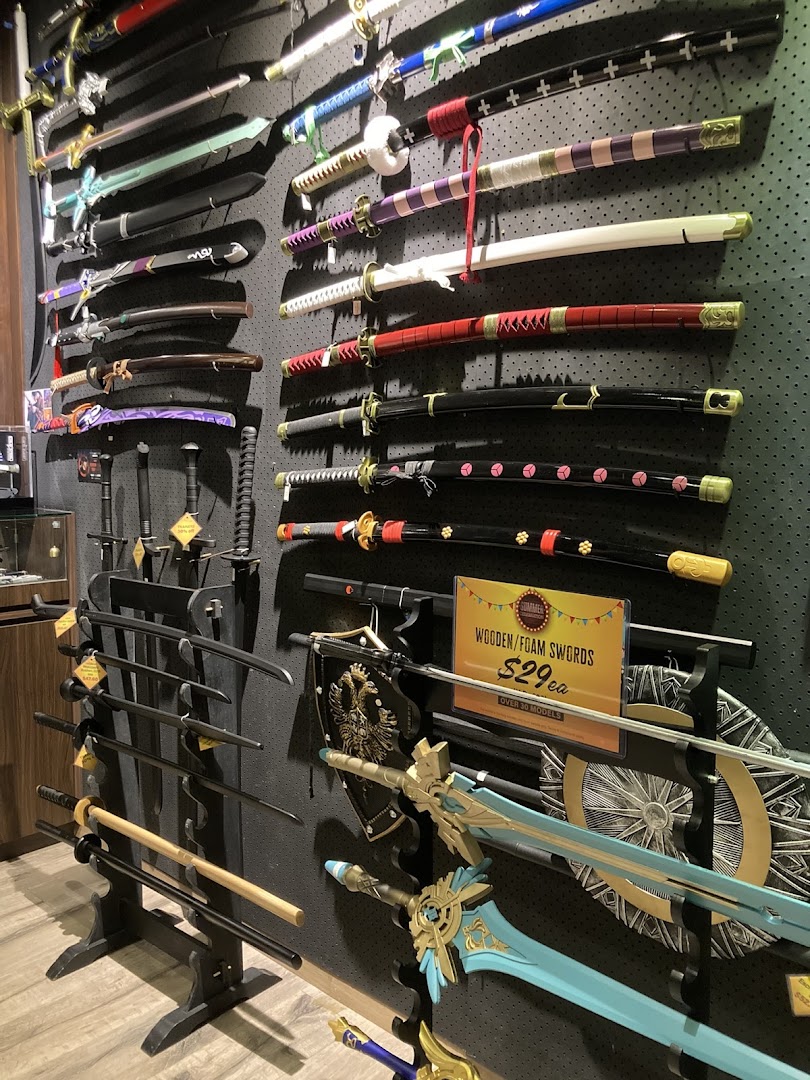 A detailed view of a retail shop wall displaying a wide array of decorative swords and katanas.