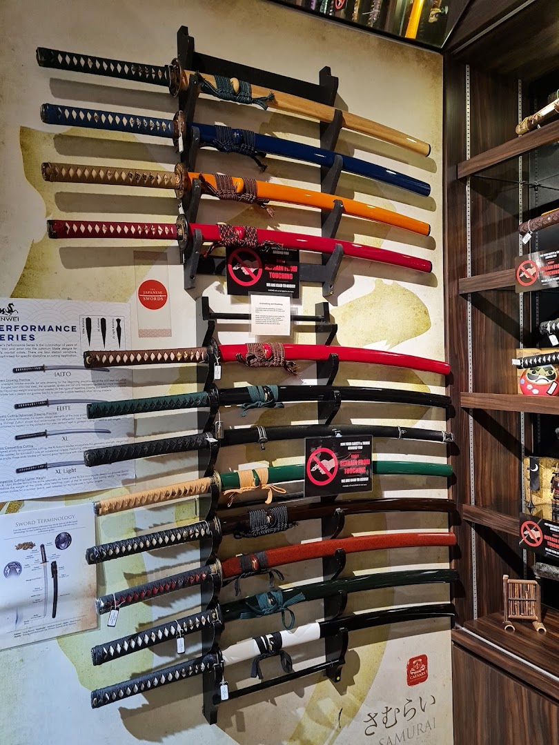 A vibrant display of various Japanese-style swords mounted on a wall, showcasing their intricate designs.