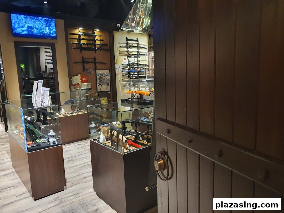 Interior view of CAESARS Swords.Guns.Armour shop, showcasing display cases with replica weapons and wall-mounted swords.