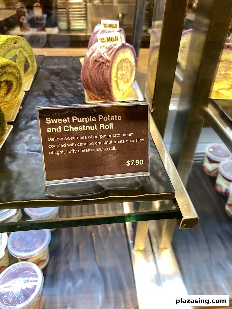 Close-up of a Sweet Purple Potato and Chestnut Roll with its detailed description and price tag in a display.