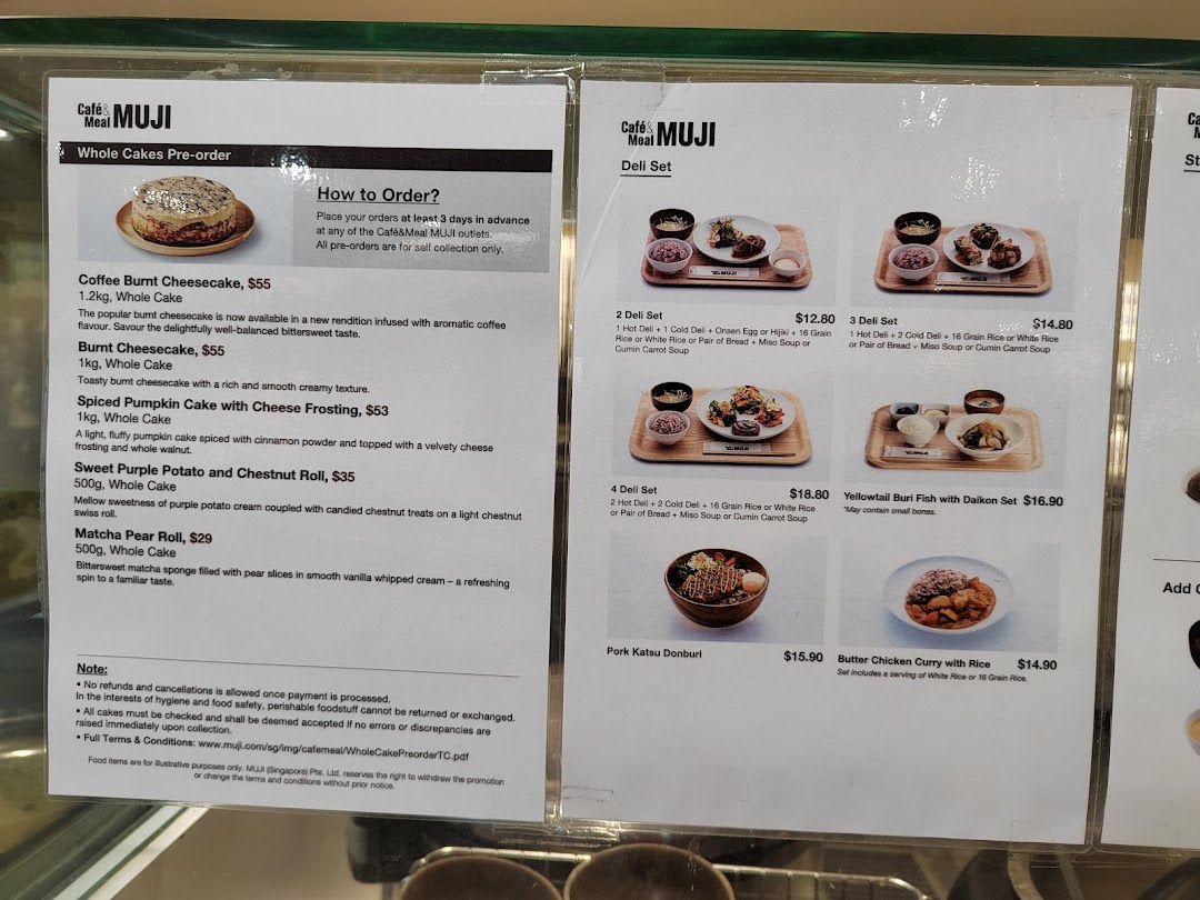 Two menu boards for Café&Meal MUJI, displaying whole cakes for pre-order and various deli sets.