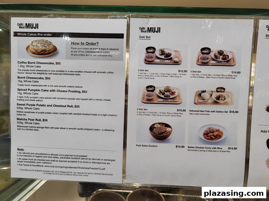 Two menu boards for Café&Meal MUJI, displaying whole cakes for pre-order and various deli sets.