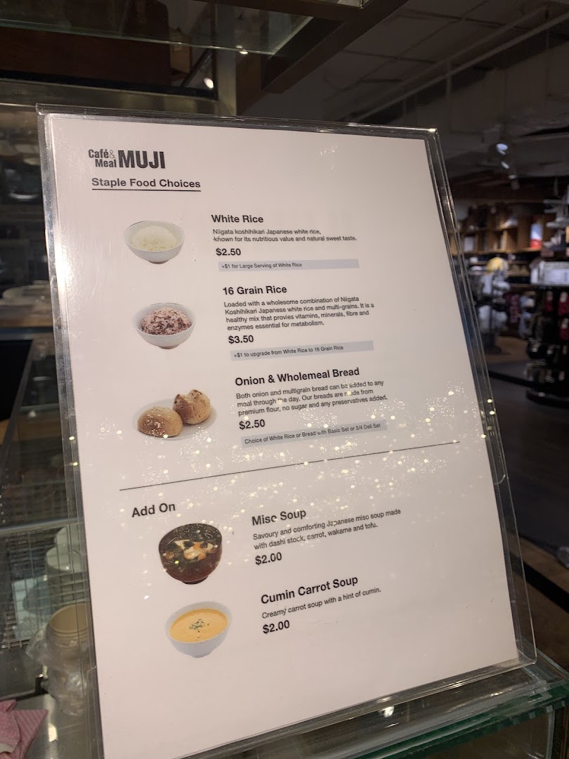 A detailed menu from CafèMeal MUJI, showcasing staple food choices and add-on soups.