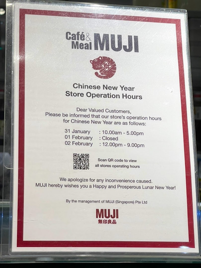 A sign displaying Cafè&Meal MUJI's Chinese New Year store operation hours.