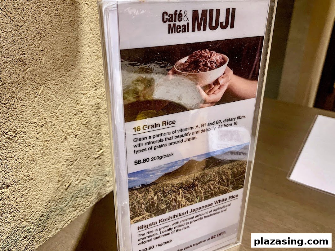 A close-up of a menu display featuring healthy rice options and their descriptions at Café&Meal MUJI.