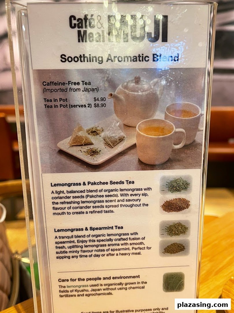 A close-up of a menu board from Café & Meal MUJI, featuring soothing aromatic tea blends.