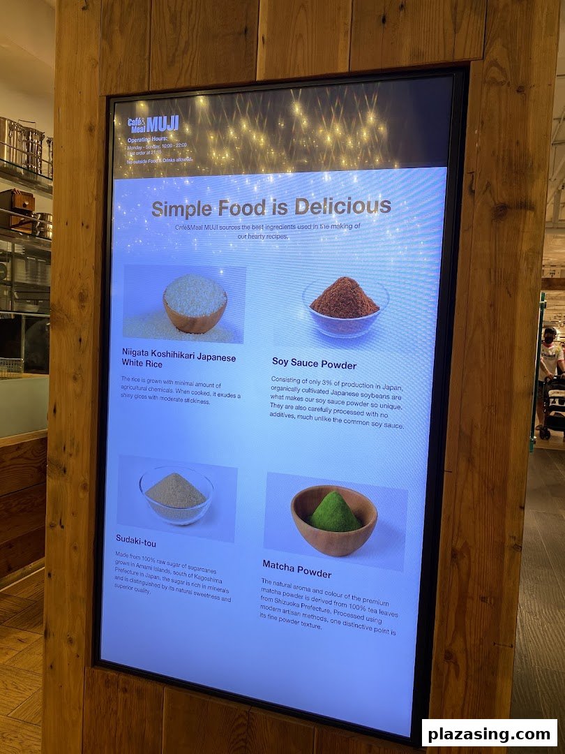 A digital display at Café&Meal MUJI showcasing the quality ingredients used in their dishes.