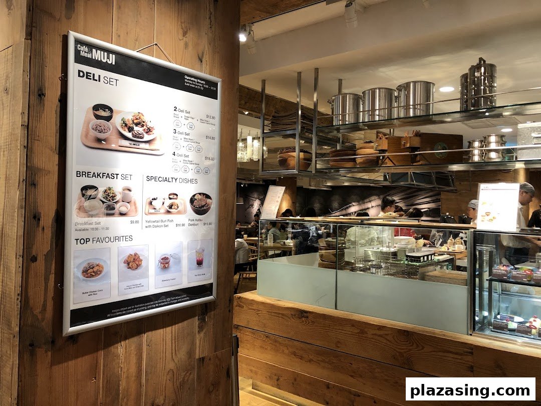 A large menu board for Cafe&Meal MUJI, showcasing deli sets, breakfast, and specialty dishes.