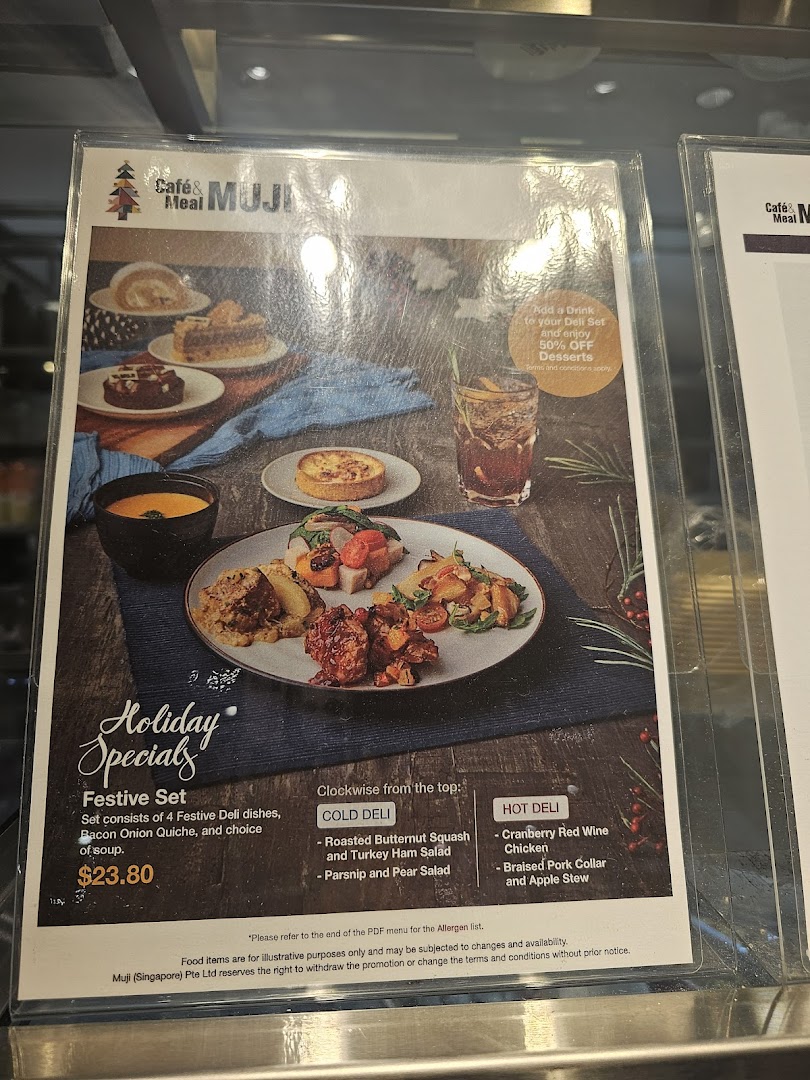 A menu board for Café & Meal MUJI showcasing their Holiday Specials and Festive Set.