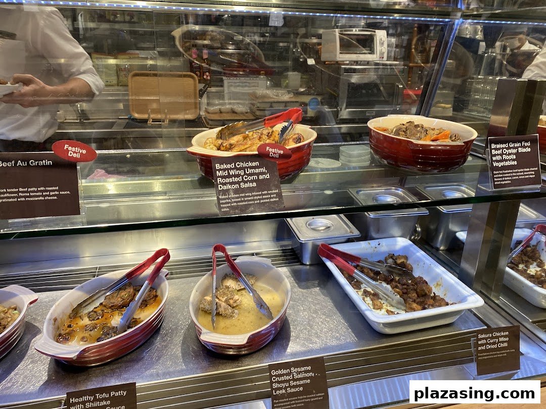 A vibrant display of freshly prepared hot dishes and deli items at CafèMeal.
